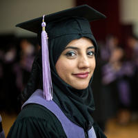 Graduate student wearing a hijab and mortarboard at graduation