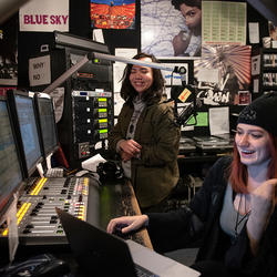 Two students behind the controls at Radio K